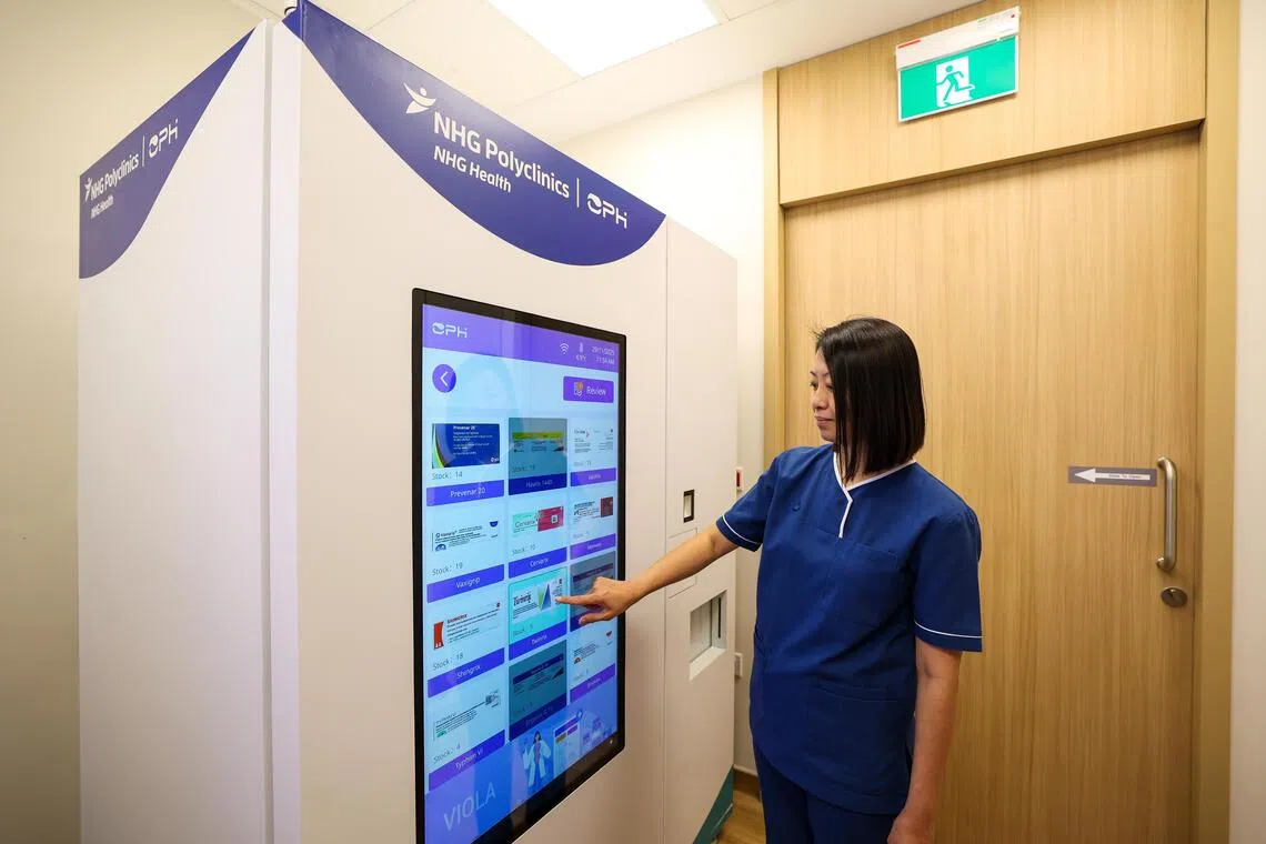 A healthcare professional using the VIOLA touchscreen in a clinic